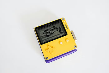 Game Boy Pocket, handheld game console, yellow console, Whitewater Wipeout, close-up photo, modern console, portable gaming, retro gaming, handheld device, game display, gaming device