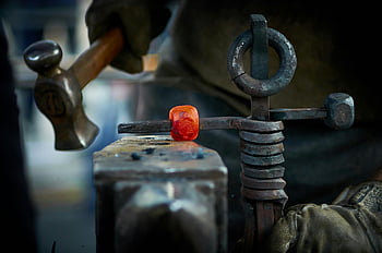 blacksmith, hammer, hot iron, anvil, indoor smithy, metal forging, craft, traditional technique, workshop, artisan, firework