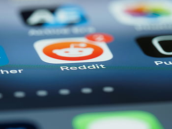 smartphone screen, close-up shot, Reddit app, notification badge, detailed close-up, smartphone display, app icon, mobile device, app notification, screen detail, app interface