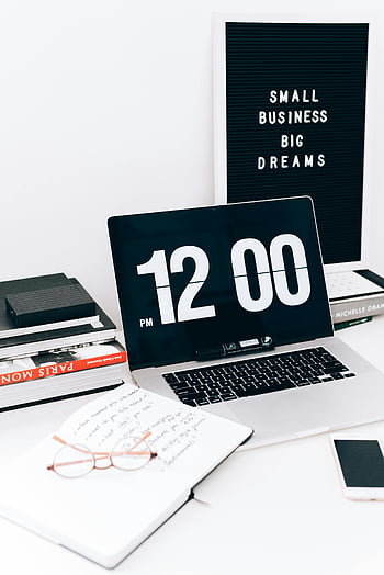 Macbook Pro, white table, digital clock, inspiring message board, clutter-free workspace, small business, big dreams, workspace setup, office desk, productivity tools, motivational quote