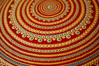 dot painting, close-up shot, vibrant colors, intricate patterns, warm color scheme, abstract art, circular design, detailed artwork, artistic patterns, colorful dots, spiral pattern