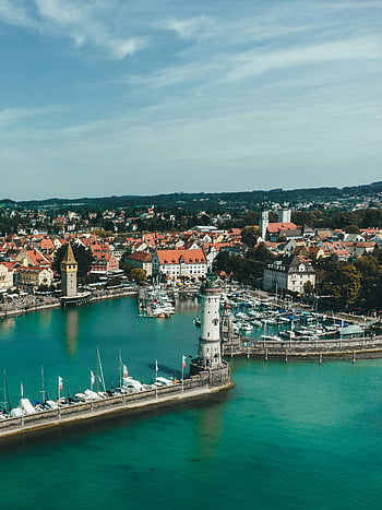 Lindau, Germany, drone shot, Lindau Harbor, lighthouse, marina, Lake Constance, aerial view, town, breathtaking, waterfront