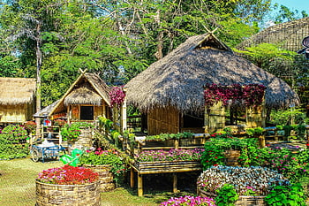 huts, flowers, rustic huts, lush garden, colorful flowers, serene atmosphere, outdoor setting, natural beauty, garden huts, thatched roof, bamboo structures