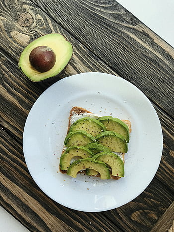 avocado toast, white plate, half avocado, rustic wood, healthy breakfast, sliced avocado, toast, avocado, breakfast, white ceramic plate, healthy food