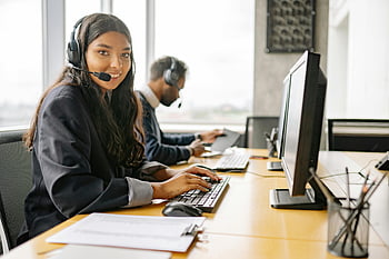 smiling woman, call center, customer support, office, computer, headset, agent, desk, workplace, professional, smiling