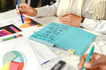 daily task, notebook, business meeting, hands taking notes, analyzing graphs, colorful charts, office work, planning, productivity, workplace, collaboration