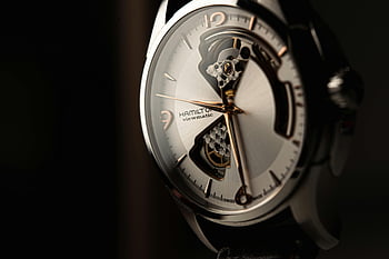 silver luxury watch, black luxury watch, close-up wristwatch, sophisticated craftsmanship, mechanical design, Hamilton watch, Viewmatic watch, detailed watch, luxury timepiece, watch photography, high-end watch