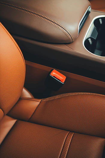 car seat belt, luxury car interior, brown leather seats, sleek design, comfort, close-up, car interior, leather seats, car seats, car design, comfort features