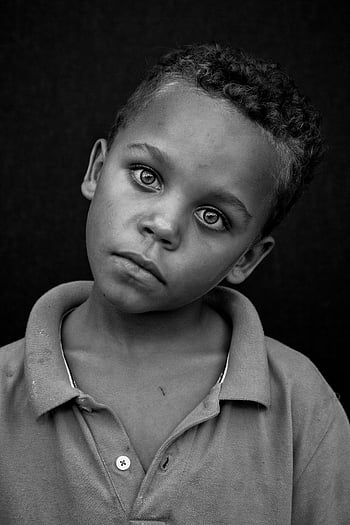 Boy, Polo Shirt, Greyscale Portrait, Black and white, Young boy, Thoughtful expression, Studio captured, Child photography, Monochrome image, Portrait photography, Studio portrait