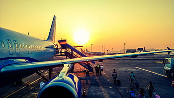 airplane, sunrise, passengers boarding, air travel, vibrant image, airport, travel photography, morning flight, travel experience, aviation, travel industry