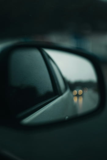 car side mirror, rainy road, blurred view, moody atmosphere, reflection, car mirror, wet road, rainy day, vehicle mirror, side view mirror, raindrops
