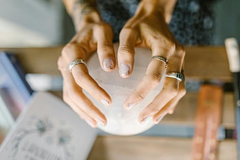 rings, crystal sphere, spirituality, healing, silver ring, white ceramic bowl, tattooed hands, crystal ball, spiritual healing, hand jewelry