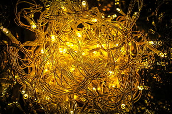 yellow Christmas lights, close-up, tangled string lights, golden lights, festive glow, holiday decor, string lights, Christmas decor, holiday lights, golden glow, close-up lights