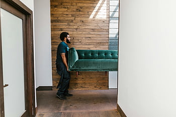 mover, green sofa, indoor relocation, modern interior design, relocation services, carrying furniture, indoor moving, professional mover, green couch, indoor furniture move, modern home decor