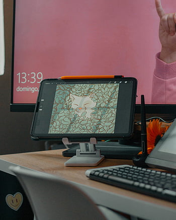 tablet on table, cozy workspace, digital art, vibrant screen, keyboard, workspace setup, desk setup, tablet stand, creative workspace, digital illustration, office desk