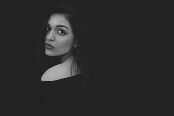 grayscale photo, woman in black top, black and white portrait, elegance, beauty, mysterious gaze, captivating, portrait photography, monochrome, female beauty, black top