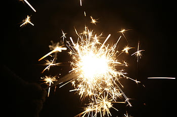 firecrackers, sparklers, close-up, burst of light, celebrations, night, sparks, festive, pyrotechnics, handheld fireworks, bright light