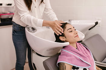 woman, hair wash, modern salon, self-care, pampering, relaxing, salon sink, hair care, beauty treatment, towel, stylist