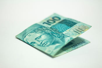 Brazilian 100 real banknote, currency, finance, detailed image, close-up view, white surface, money, banknote, Brazilian currency, finance themes, currency themes