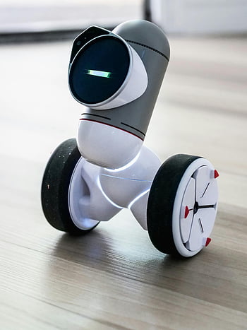 White and Black Robot Toy, modern robotic device, wheels, advanced technology, close-up, toy robot, robotic toy, modern robot, technology toy, robot wheels, advanced toy