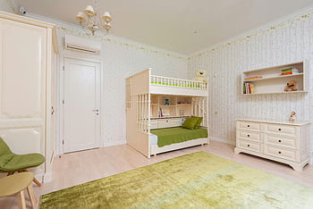 modern children bedroom, bunk bed, green accents, shelves, cabinet, bright bedroom, tidy room, modern furniture, green rug, white walls, teddy bears