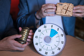 escape room, puzzle lock, timer, close-up, hands, escape room setting, props, puzzle, lock, Secura