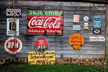 vintage advertising signs, rustic wooden wall, classic brands, Coca-Cola signage, drug store drink, Shell Motor Oil, Sherwin Williams Paints, Texaco Motor Oil, Canada Dry Beverage, Fincks Verballs, Vory's Soap