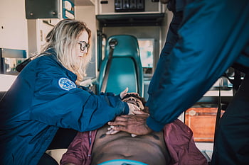 paramedic, performing CPR, emergency responders, patient, ambulance setting, medical emergency, chest compressions, rescue, healthcare, first aid, ambulance