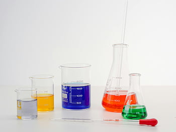colorful liquids, laboratory glassware, science themes, research themes, beakers, flasks, chemical solutions, lab equipment, scientific experiments, laboratory setup, vibrant chemicals