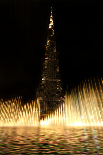 burj khalifa, water fontein, nacht zicht, verlichte fonteinen, dubai, vae, boeiend uitzicht, wolkenkrabber, stadsgezicht, mijlpaal, architectuur