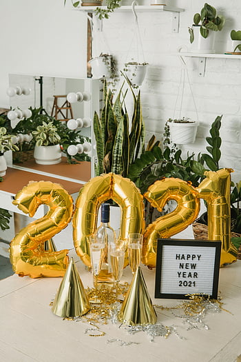 New Year 2021, gold letter balloons, festive hats, indoor party decor, gold balloons, champagne glasses, party table, happy new year, festive decorations, indoor celebration, gold party hats