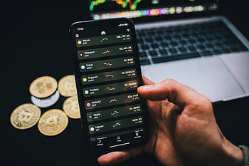 smartphone, trading graphs, cryptocurrency values, laptop, Bitcoins, person holding, cryptocurrency trading, mobile trading, digital currency, financial analysis, investment tracking