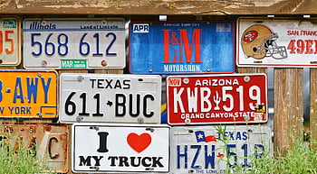 vintage license plates, rustic wooden fence, decorative display, assorted car license plates, American license plates, Texas license plate, Illinois license plate, Arizona license plate, New York license plate, San Francisco 49ers, I love my truck