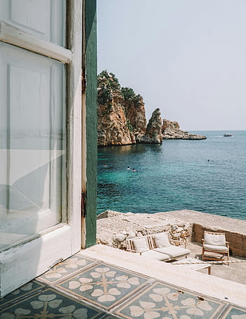 Scopello, rocky coast, terrace window, seating area, clear sea, serene view, sea shore, coastal view, outdoor seating, window opening, Italian coast