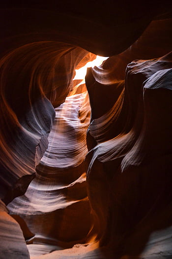 Antelope Canyon, low-angle photography, sandstone formations, light and shadow, breathtaking views, natural wonder, desert landscape, unique geology, slot canyon, Arizona, USA