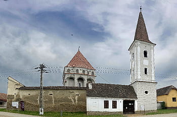 Cloașterf, fortified church, Evangelical Lutheran Church, Transylvania, 16th century, Romanesque basilica, bell tower, polygonal wall, defense towers, floral patterns, baroque altar