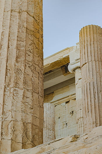 ancient Greek temple, white columns, classical architecture, ancient ruins, close-up, temple columns, historical site, ancient Greece, classical design, stone columns, architectural detail