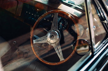 vintage car, wooden steering wheel, retro dashboard, classic car interior, brown steering wheel, black steering wheel, close-up car interior, vintage dashboard, classic wooden wheel, retro car interior, vintage car steering wheel