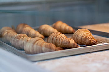 baked breads, baking pan, croissants, freshly baked, pastries, golden brown, bakery, tray, baked goods, flaky, crusty