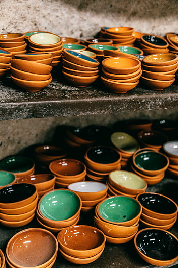 ceramic bowls, bright ceramic bowls, Turkish market stall, vibrant assortment, stacked bowls, ceramic dishes, colorful bowls, market display, handcrafted ceramics, pottery collection, traditional ceramics