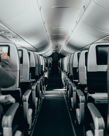 airplane seats, modern airplane cabin, clean interior, sleek design, airplane aisle, passenger seats, cabin interior, travel photography, aircraft interior, flight seats, airplane cabin design