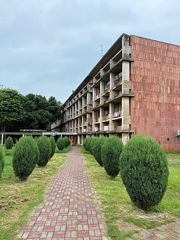 Chandigarh architecture, modern architecture, brick pathway, Chandigarh buildings, Indian architecture, architectural design, campus architecture, Chandigarh scenery, brick walkway.