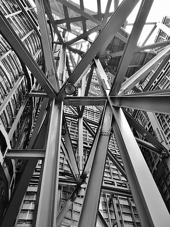 grayscale photography, scaffolding, steel framework, modern industrial architecture, detailed view, complex structure, black and white, industrial design, architectural photography, construction elements, metal beams