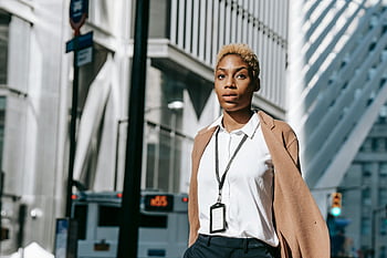 black businesswoman, stylish businesswoman, urban city street, modern city street, confident walk, bustling city, professional woman, city lifestyle, business attire, cityscape background, urban professional