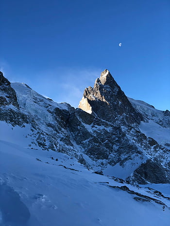 snow-capped mountains, blue sky, winter scenery, mountain peak, clear sky, dawn, breathtaking view, snowy landscape, mountain range, alpine view, moon in sky