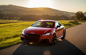 red Audi TT, rural road, golden evening light, Nittenau Germany, green mountain, stunning car, Audi car, sunset scene, countryside view, parked car, scenic landscape