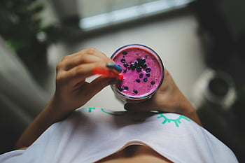 blueberry yogurt smoothie, healthy lifestyle, vibrant color, nutritious, girl holding, pop of color, yogurt smoothie, blueberry smoothie, healthy smoothie, nutritious smoothie, vibrant smoothie