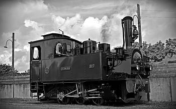 steam locomotive, vintage train, black and white photo, outdoor scene, classic locomotive, railway engine, historical train, outdoor train, steam engine, black and white image, vintage steam locomotive