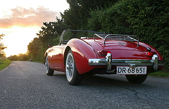 Classic Red Convertible, strada panoramica, tramonto, macchina di lusso, macchina vintage, auto rossa, auto convertibile, macchina classica, scena all'aperto, fotografia al tramonto, viaggio su strada