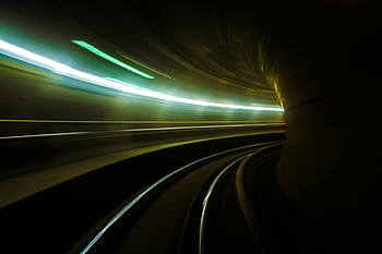 time-lapse photography, tunnel, subway tunnel, blurred light streaks, dynamic effect, futuristic effect, light trails, underground photography, motion blur, urban photography, rail tracks